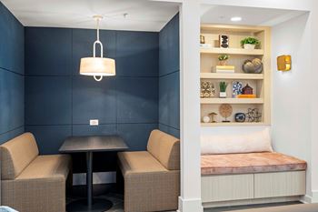 Resident co-working lounge with coffee bar and business center with pcs and wireless printing